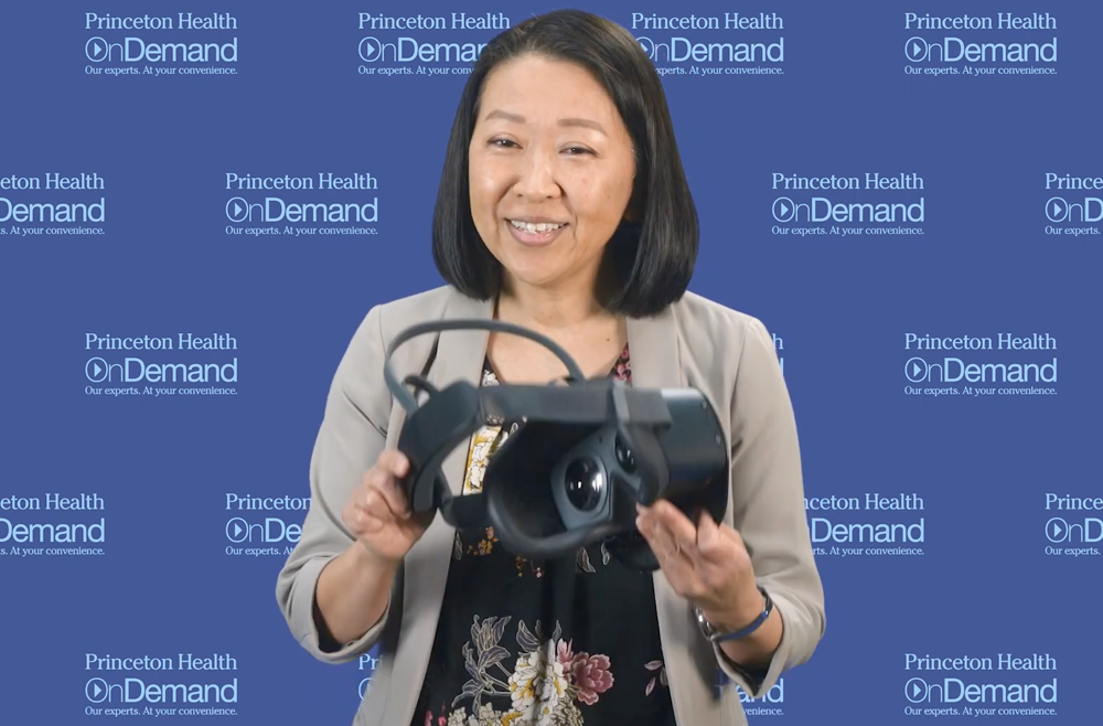 Yuko Martin holding a virtual reality headset